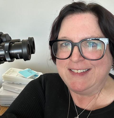 Beth behind the microscope