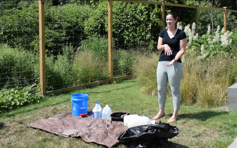 Dr. Bloodgood showing a cleanup station after a mock field outbreak investigation during a DEC Wildlife Health workshop - emphasizing the importance of biosecurity in the field.